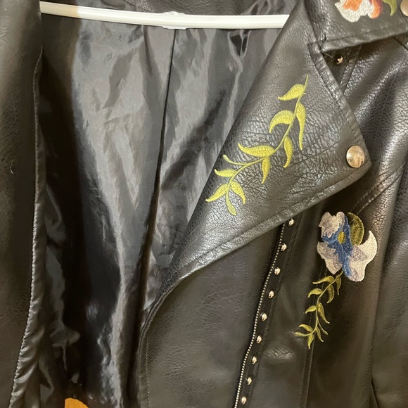 Floral embroidery, stud accents, buckles on side, faux leather, zipper on arms. - Picture 8 of 8